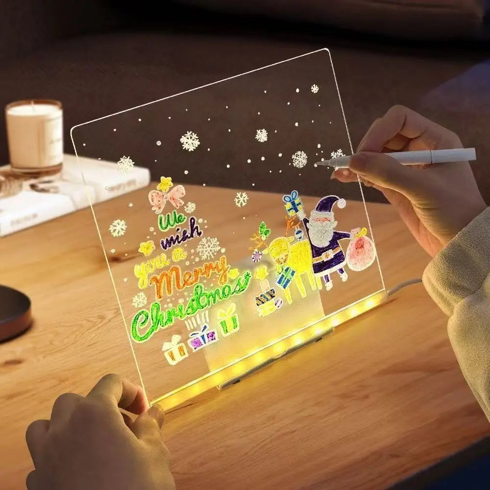 Child drawing a Christmas scene on the clear GlowBoard LED board
