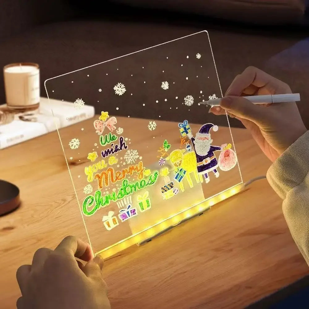 Child writing a holiday message on the GlowBoard LED drawing board in the evening