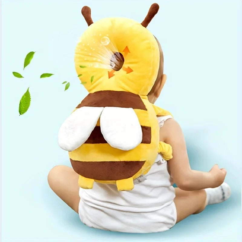 Baby sitting on the floor seen from behind wearing the Little Bee head cushion
