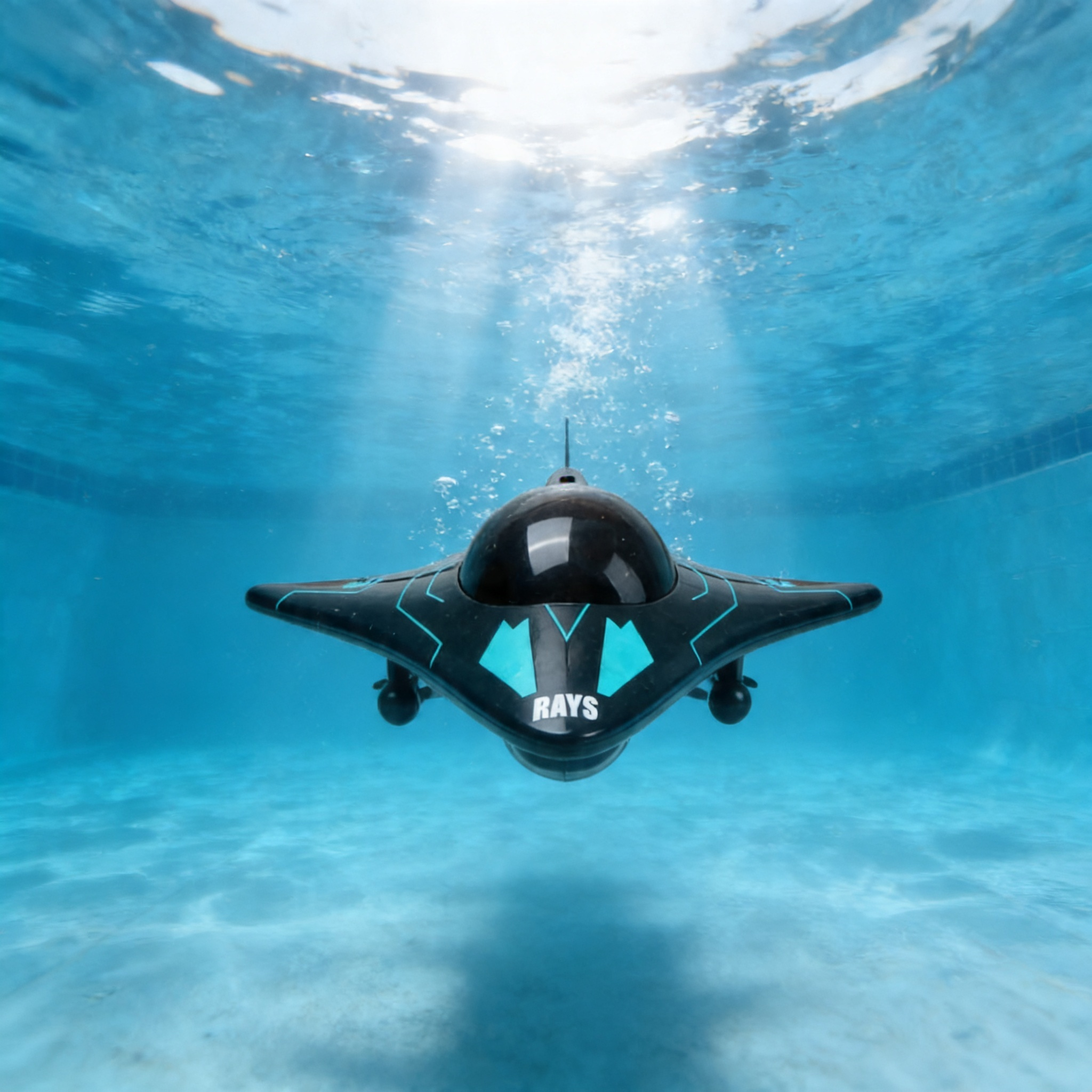 Front view of the AquaSpy submarine with dome camera cruising underwater in a pool