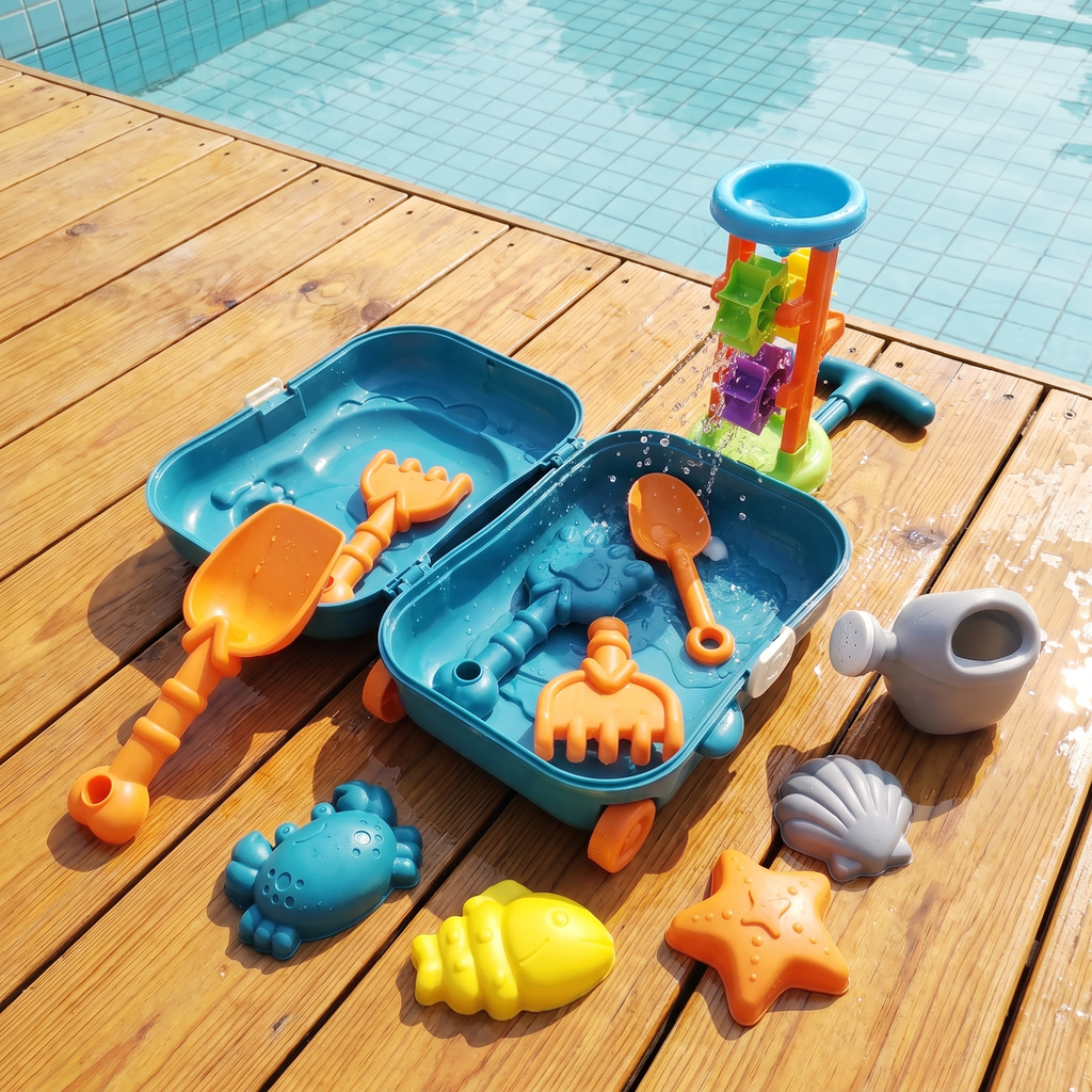 Kids beach toy suitcase open on a sunny poolside deck with sand molds and water-wheel tower spinning water
